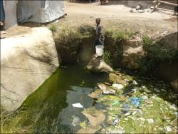 Vulnerable groundwater surfacing in a sinkhole, extended by quarrying